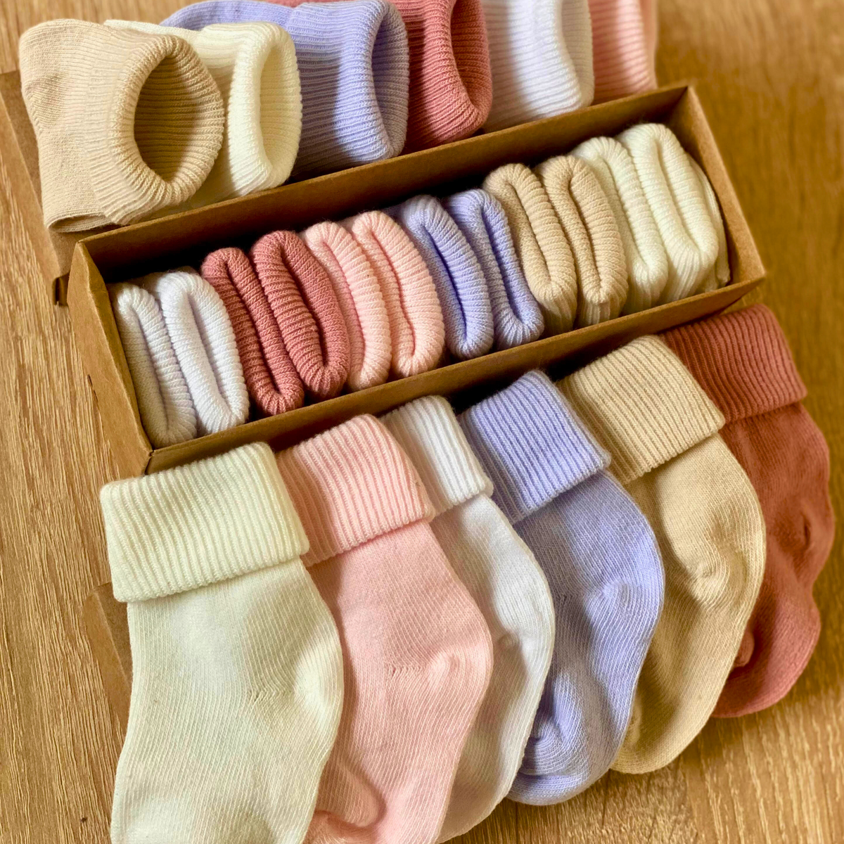Soft ribbed baby socks in warm pastel and neutral colours