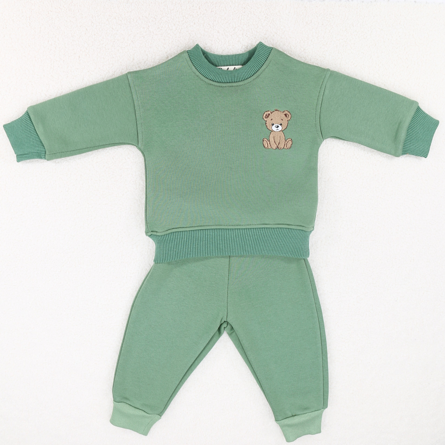 Cosy sage green baby tracksuit set featuring teddy bear embroidery