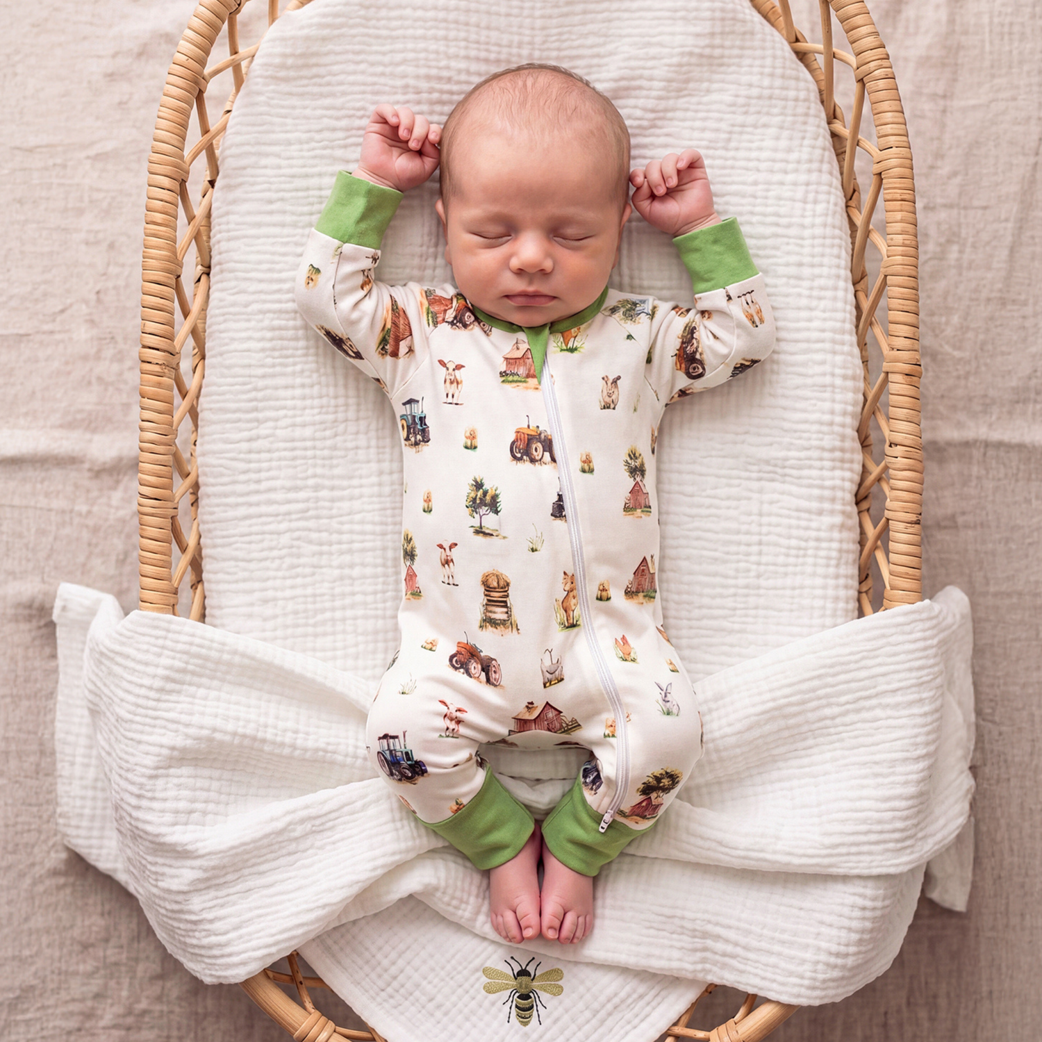 Baby wearing Farm Friends double zip baby sleepsuit with farm animal print