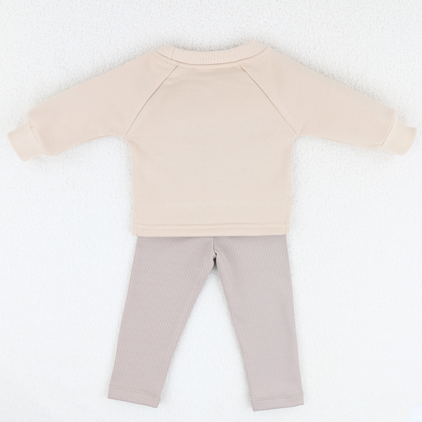 Back view of beige baby sweatshirt and ribbed leggings set