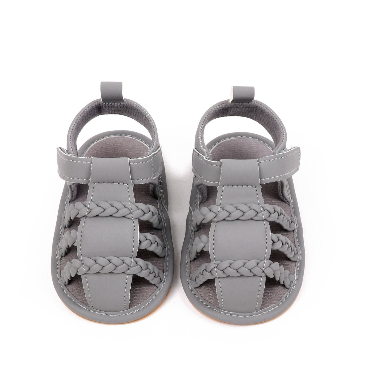 Baby unisex grey sandals pair top down view showing triple braided strap pattern and velcro closure by Babyli, boutique soft sole baby shoes UK