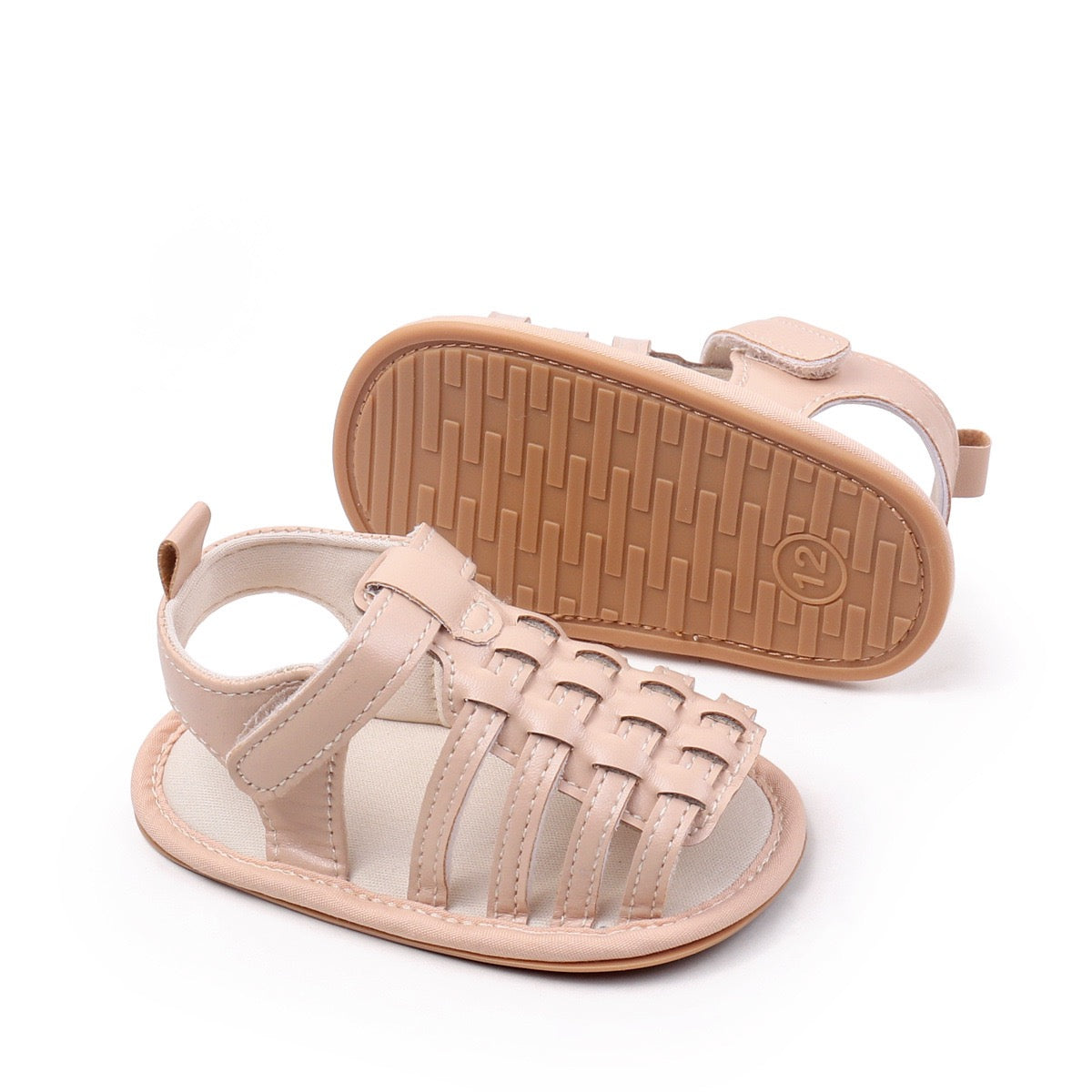 Baby unisex nude woven leather sandal showing non-slip rubber sole with grip pattern and side front view by Babyli, soft sole baby shoes UK