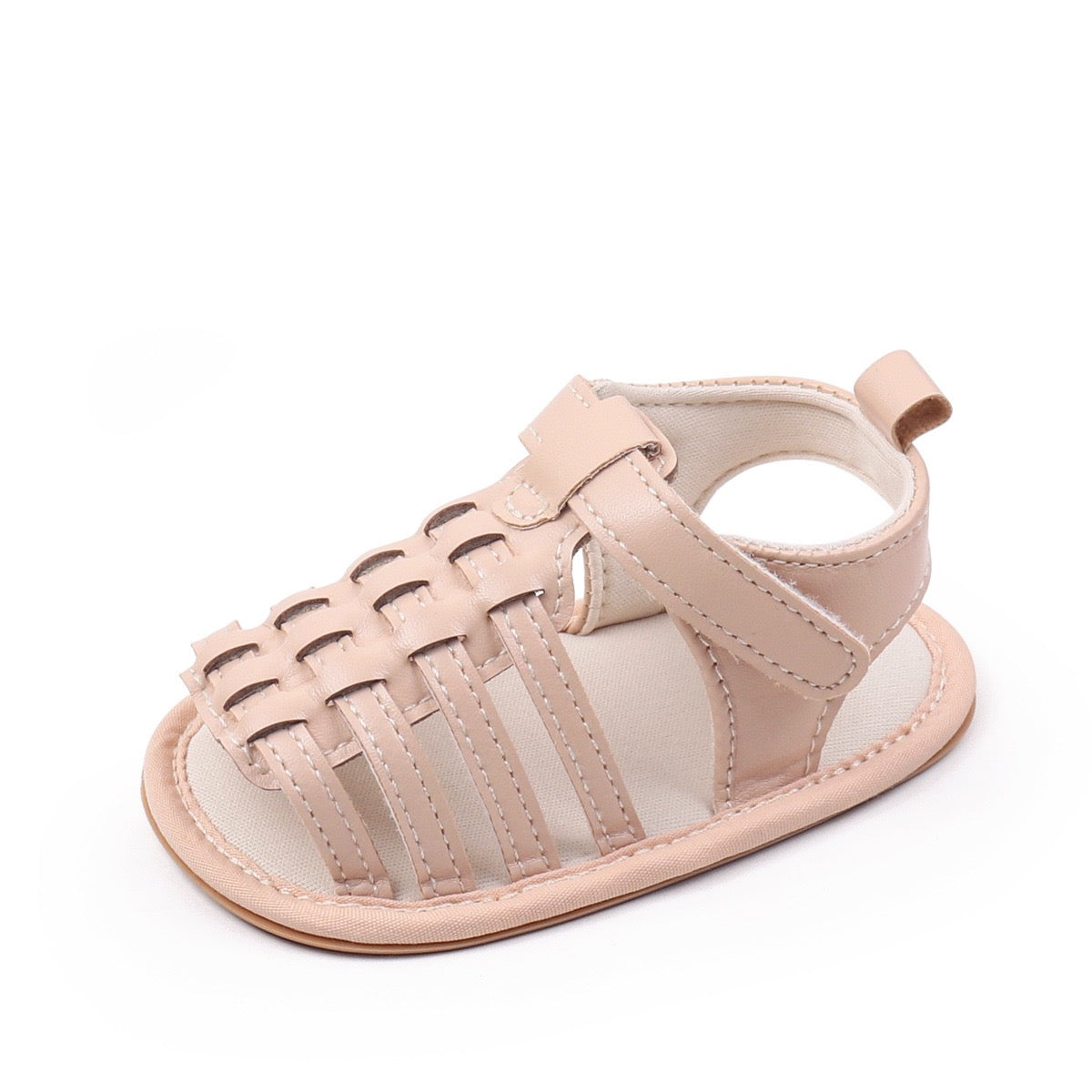 Baby unisex nude woven leather sandal single shoe close up showing detailed woven upper velcro strap and soft insole by Babyli, boutique baby shoes UK