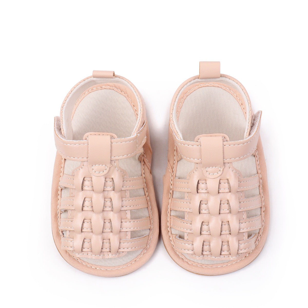 Baby unisex nude woven leather look sandals top down pair view showing intricate woven upper and velcro strap by Babyli, boutique soft sole baby shoes UK