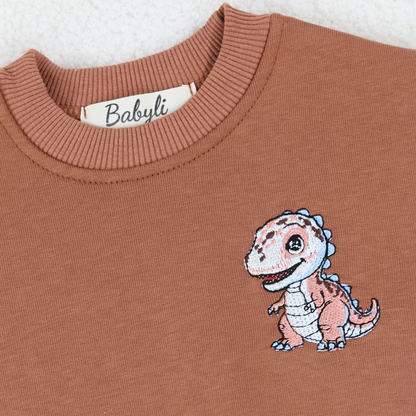 Embroidered dinosaur detail on Babyli brown baby tracksuit