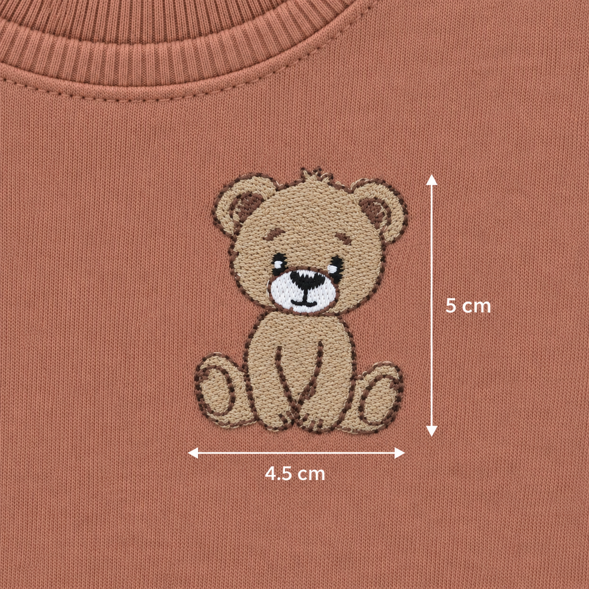 Embroidered teddy bear detail on Babyli brown baby tracksuit, 5 cm by 4.5 cm
