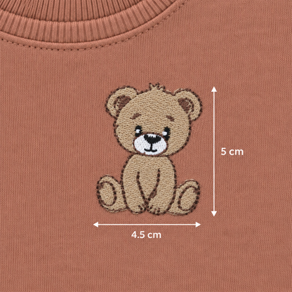 Embroidered teddy bear detail on Babyli brown baby tracksuit, 5 cm by 4.5 cm