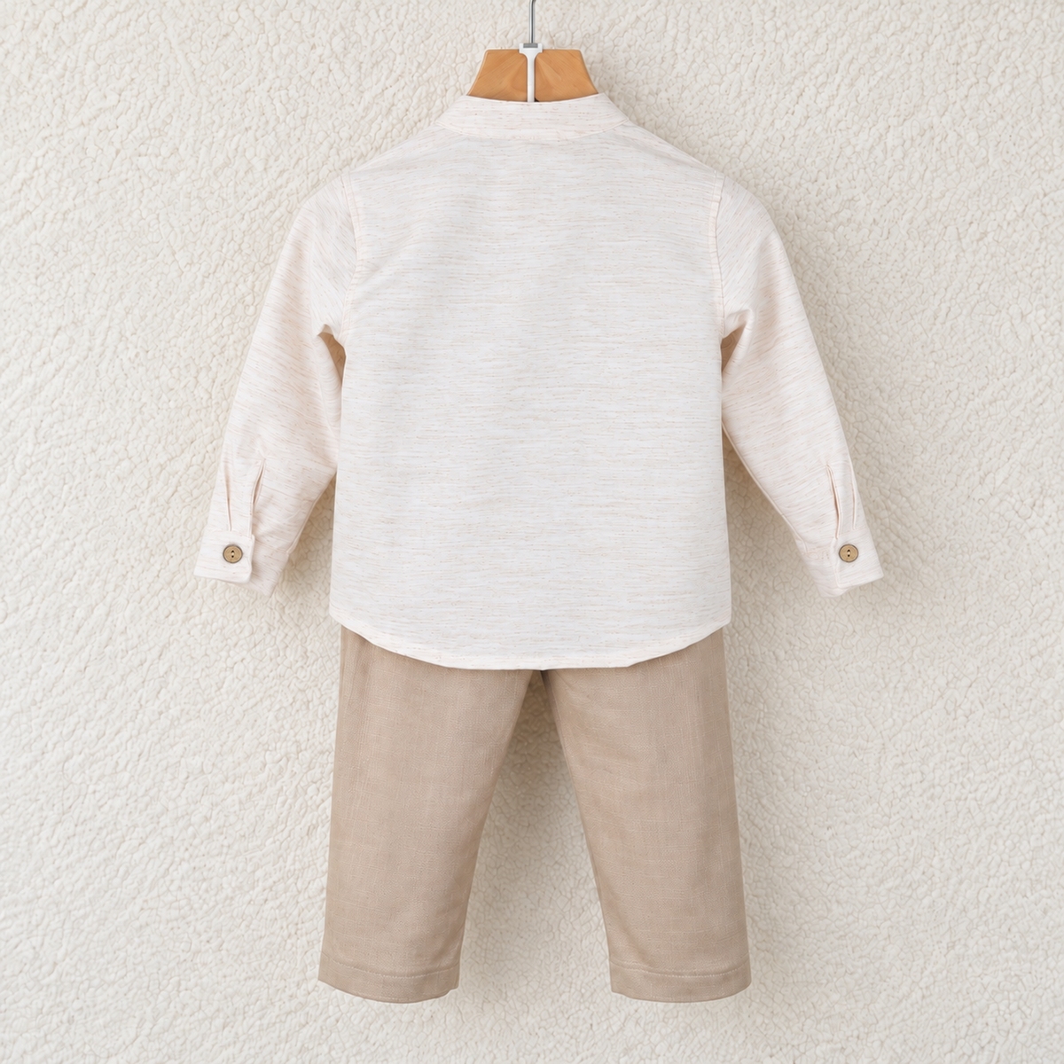 Back of Babyli cream shirt and beige trousers set with coconut cuff buttons