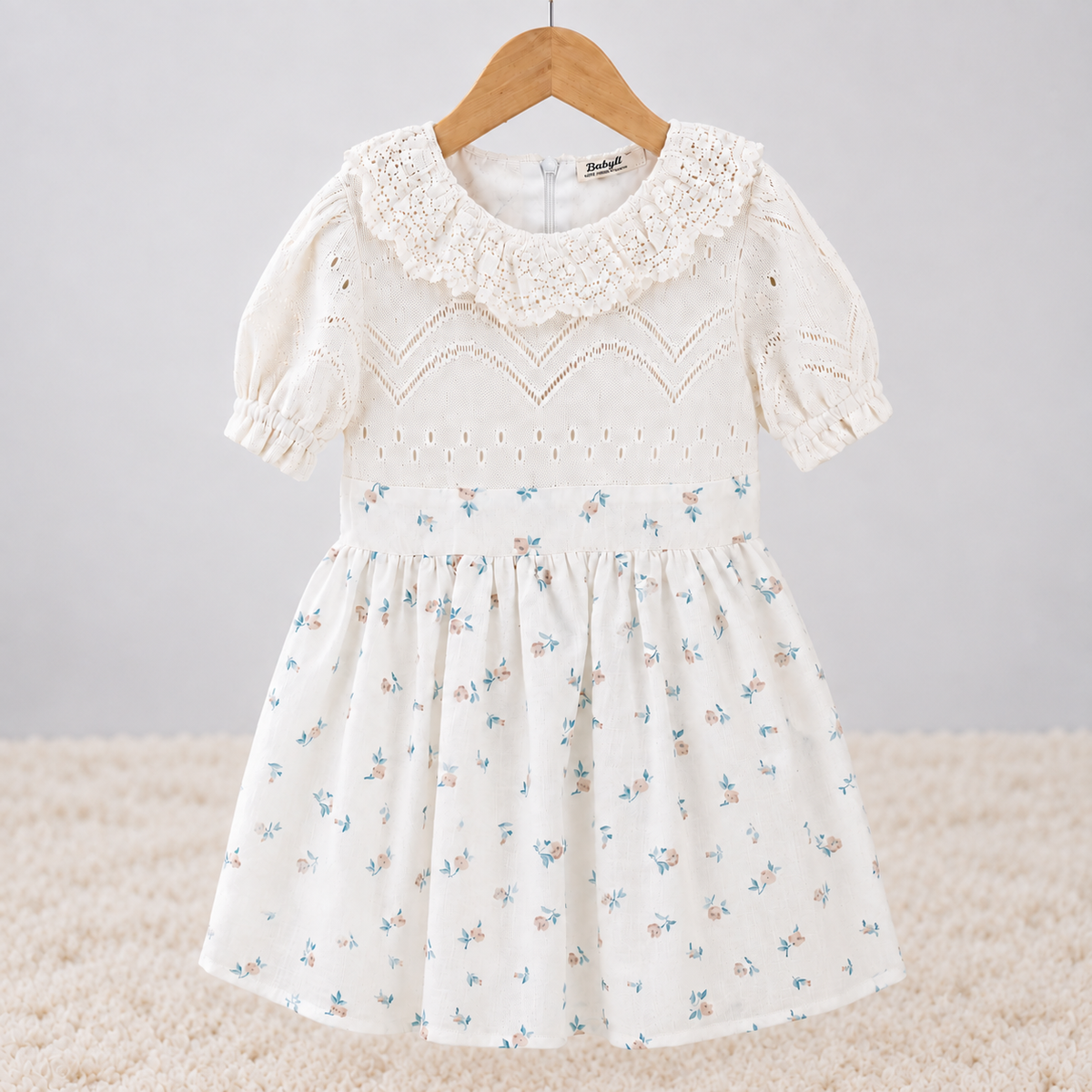 Babyli ivory floral baby and toddler knit dress with ruffle collar, puff sleeves and floral skirt, front view