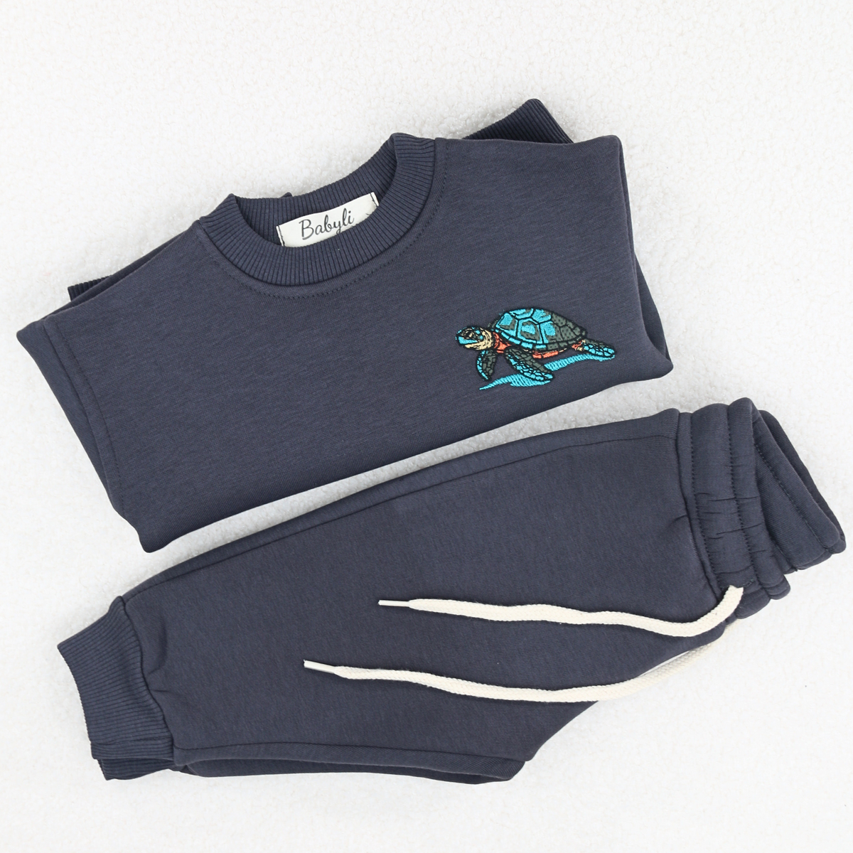 Babyli navy blue turtle baby toddler tracksuit flat lay