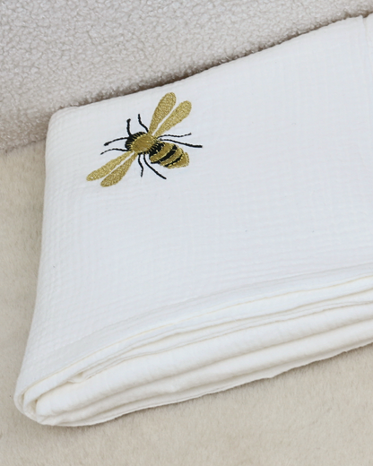 White muslin baby blanket with embroidered bees