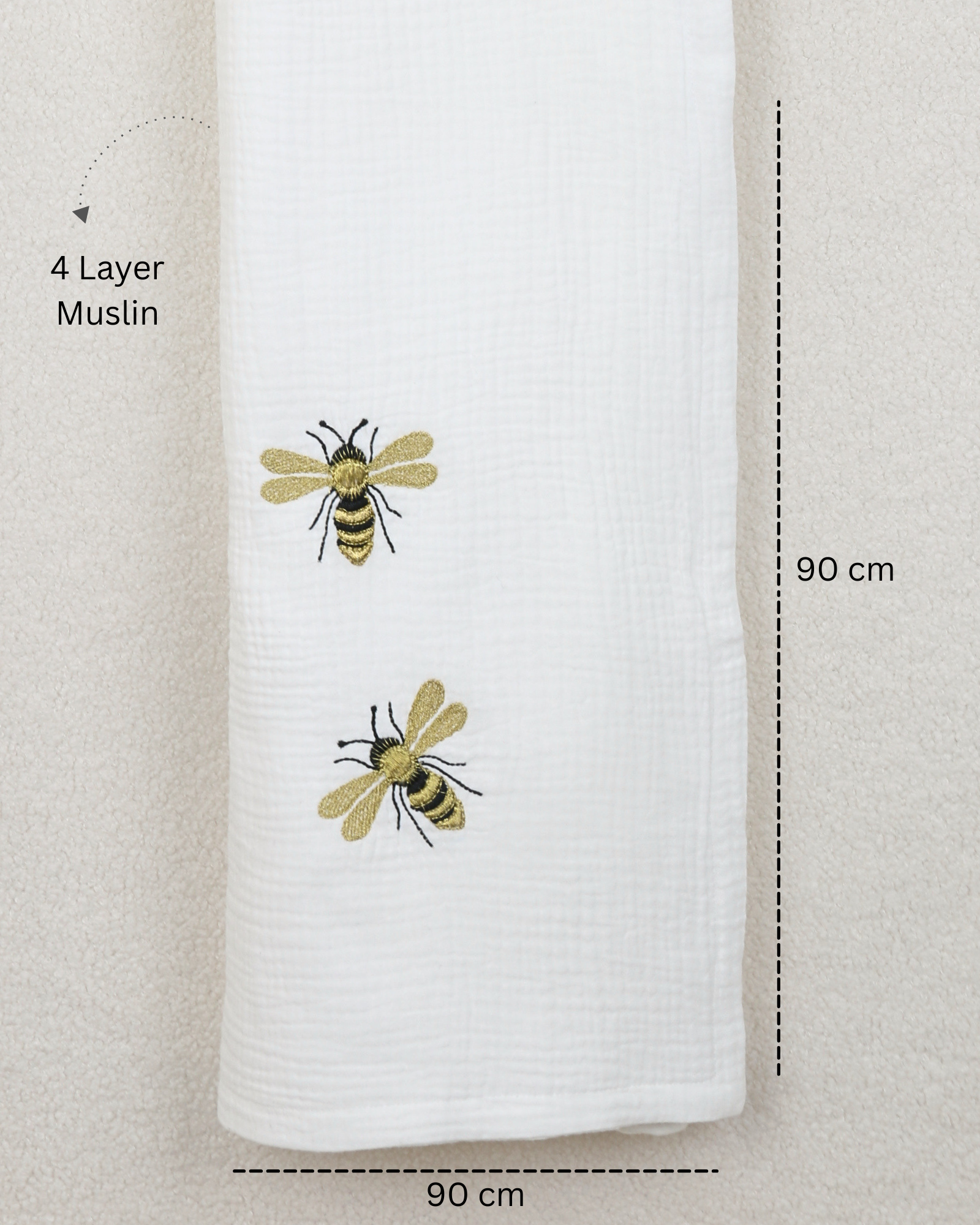 White muslin baby blanket with embroidered bees