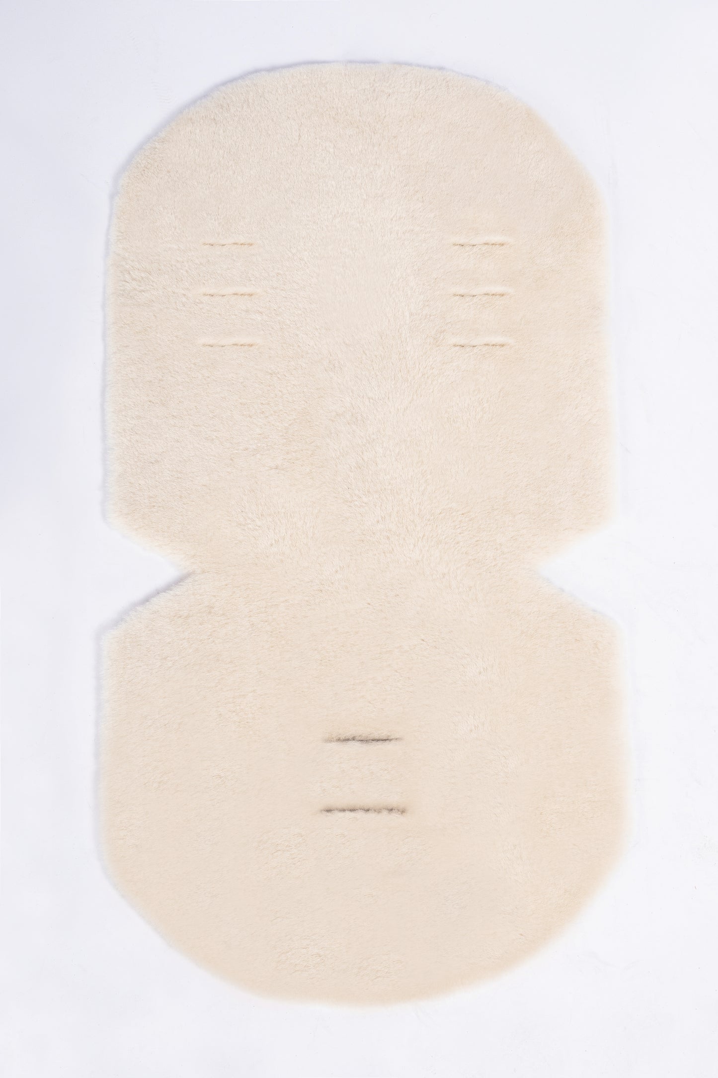 Cosy genuine sheepskin baby pram liner with soft wool finish.