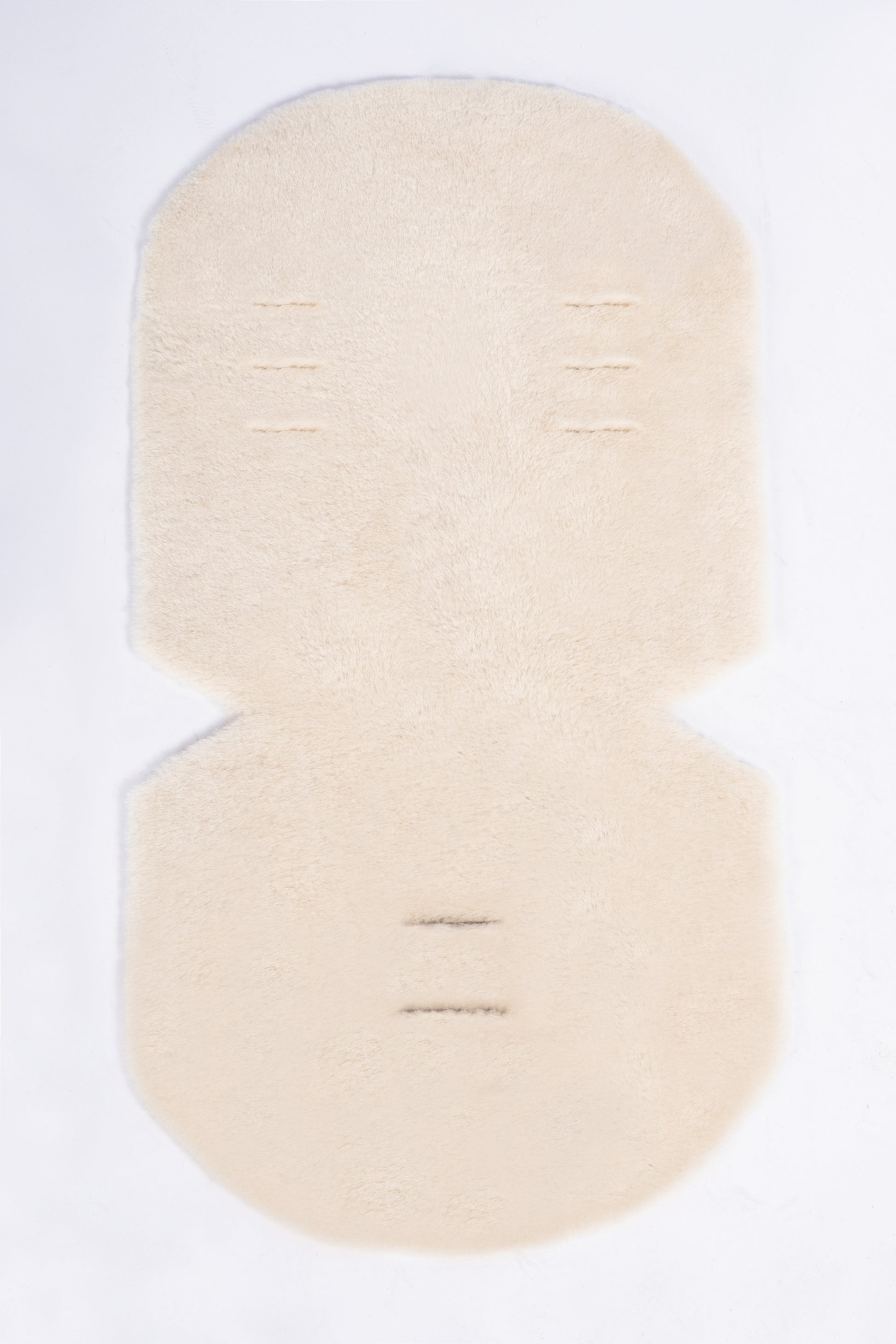 Cosy genuine sheepskin baby pram liner with soft wool finish.
