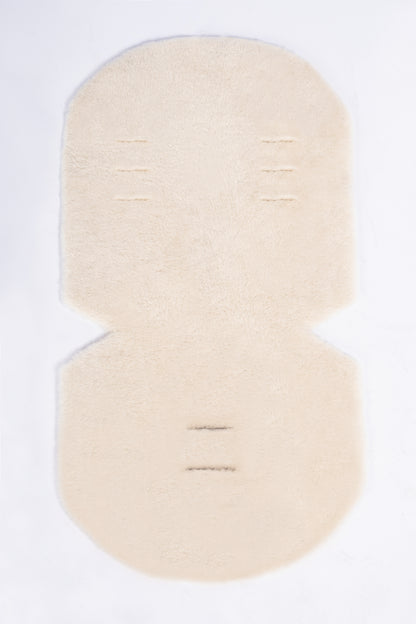 Cosy genuine sheepskin baby pram liner with soft wool finish.