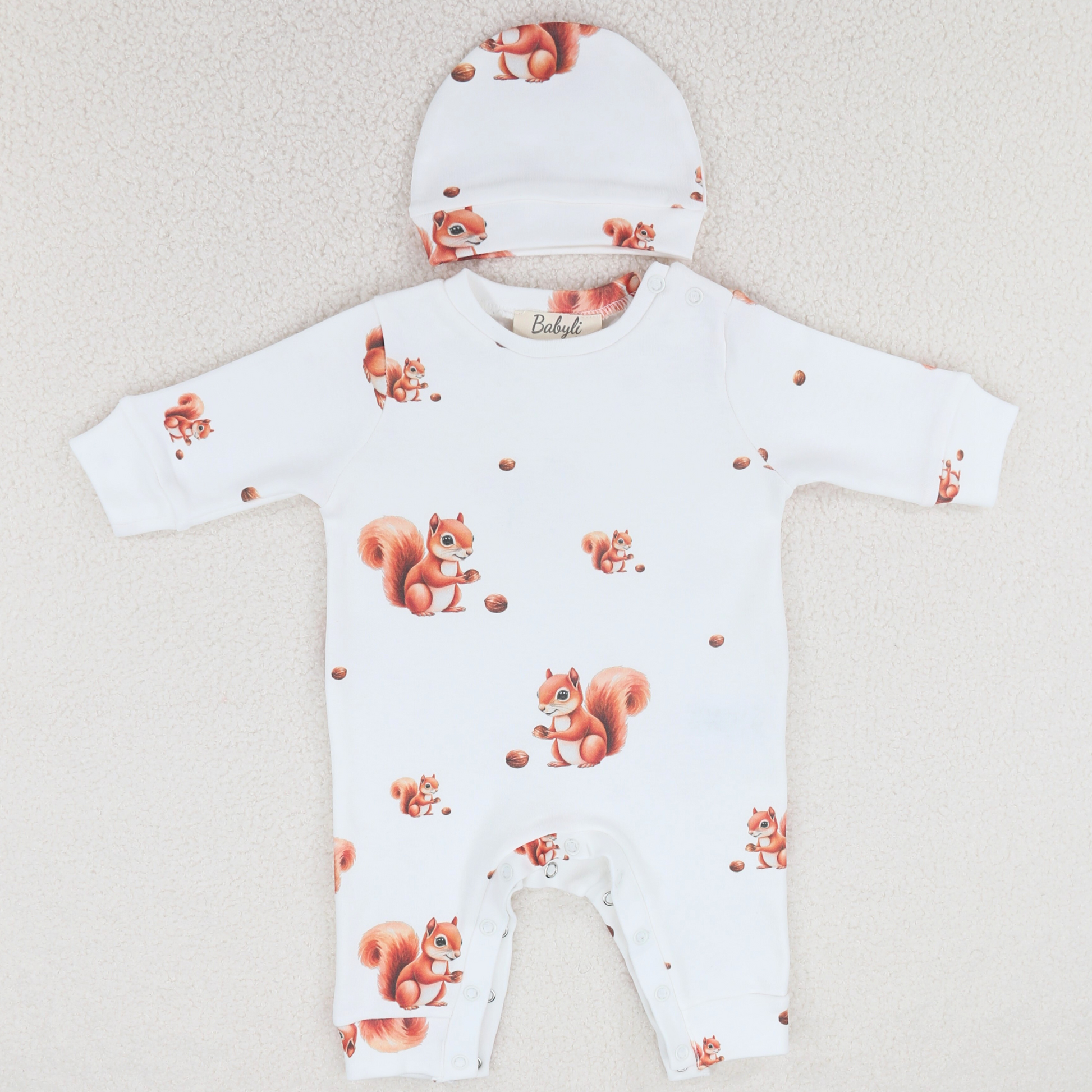 Cotton baby grow with squirrel print and matching baby hat.