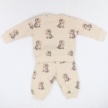 Cream baby sweatshirt and jogger set with dinosaur print