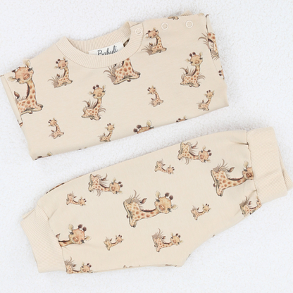 Folded beige baby and toddler  two-piece set with giraffe print