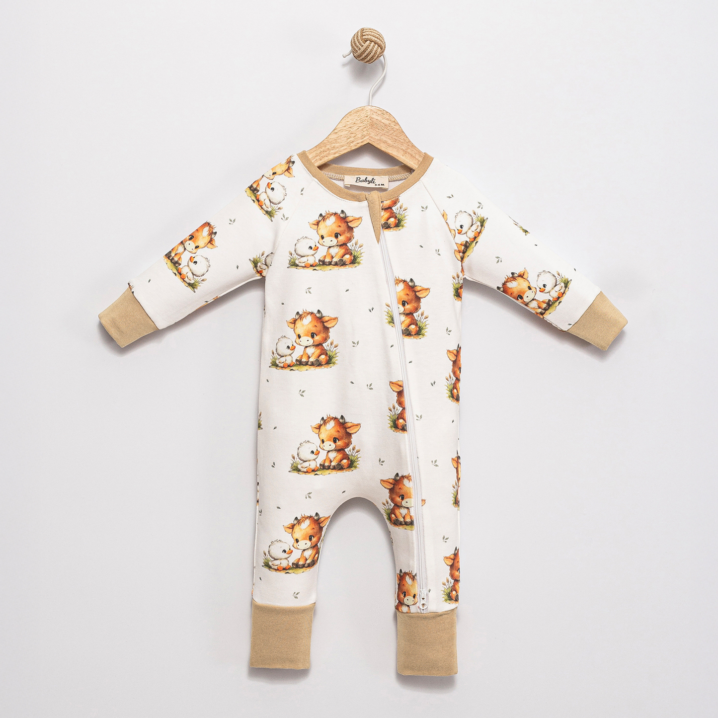 Front view of Babyli Highland Cow Double Zip Baby Sleepsuit featuring a Highland cow print and two-way zip fastening