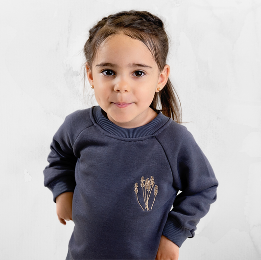 Girls navy sweatshirt with delicate embroidered detail.