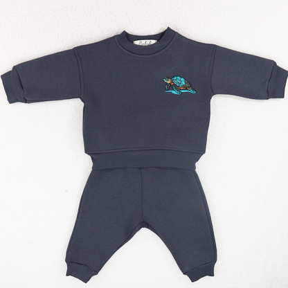 Navy baby and toddler tracksuit with embroidered turtle detail