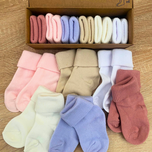 Soft ribbed baby socks in pastel pink, lilac and neutral colours