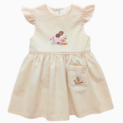 Girls sleeveless linen dress with rabbit embroidery and floral details.