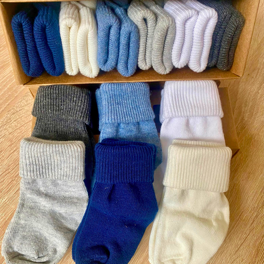 Soft ribbed baby socks in blue, grey and neutral colours